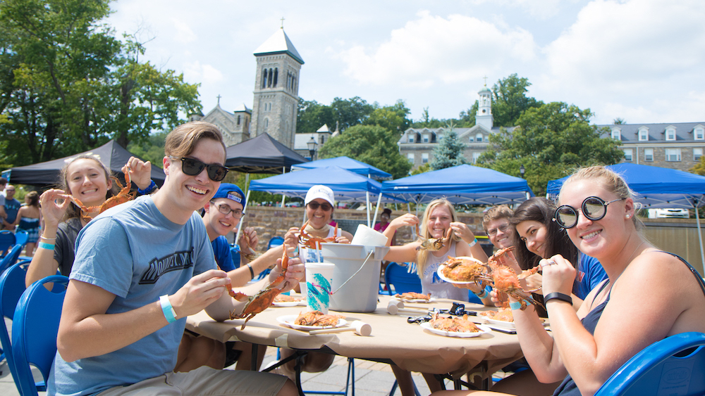 students at crab feast at peace plaza
