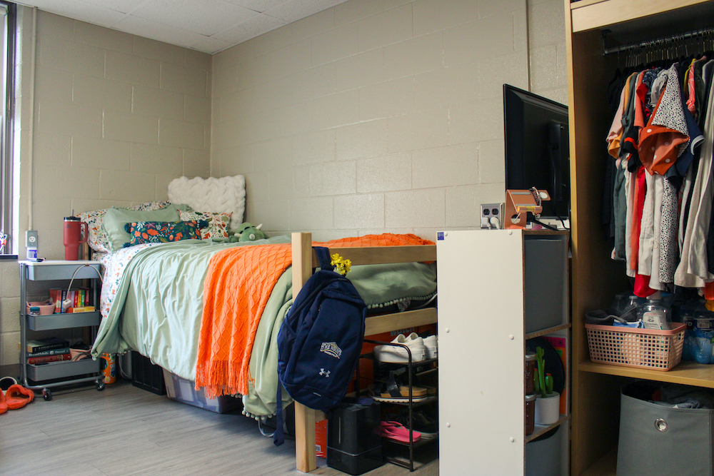 a view of a bed and closet in a room in sheridan hall at msmu