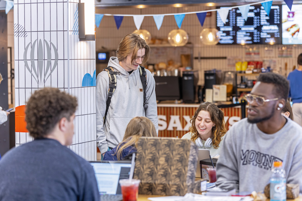 students talking and eating at saxbys